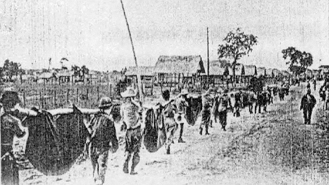 Carrying the dead, Camp O’Donnell. The latrines soon overflowed, and disease was epidemic.