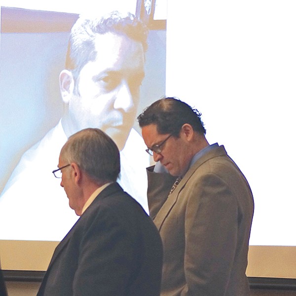 Attorney Weston with Rodriguez and evidence photo displayed in court