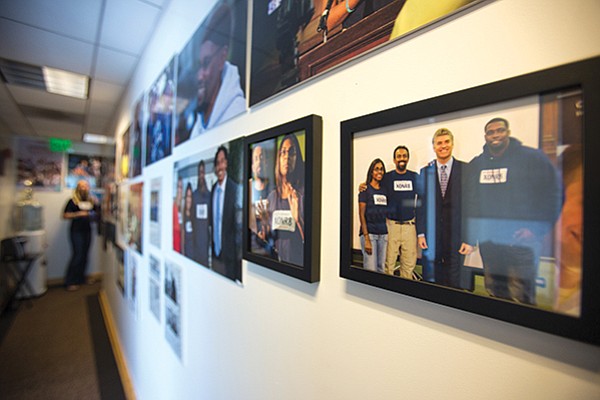 Photos of successful exonerations line the hallways of the California Innocence Project office.