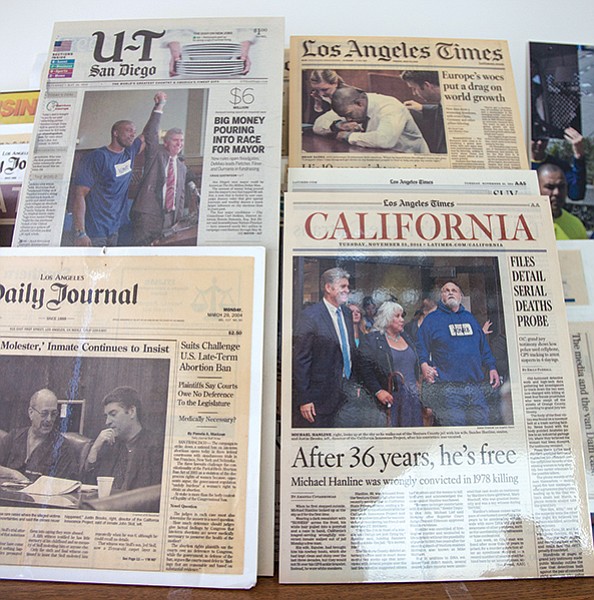 Newspaper clippings from past Innocence Project cases