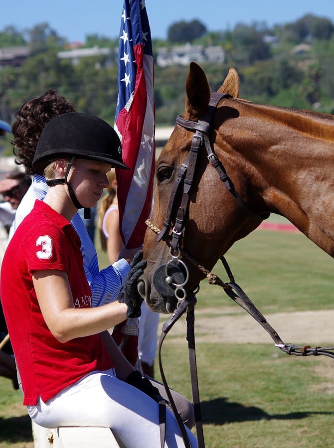 Young Friends

This young gal and her horse were keeping each other company while waiting to parade with the American Flag.  This was at the San Diego Polo Club on August 16, 2015.