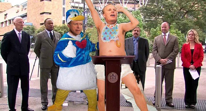 Faulconer and Goldsmith — in Charger-mandated diaper and Donald Duck suit, respectively — accuse team management of "unserious" attitude.