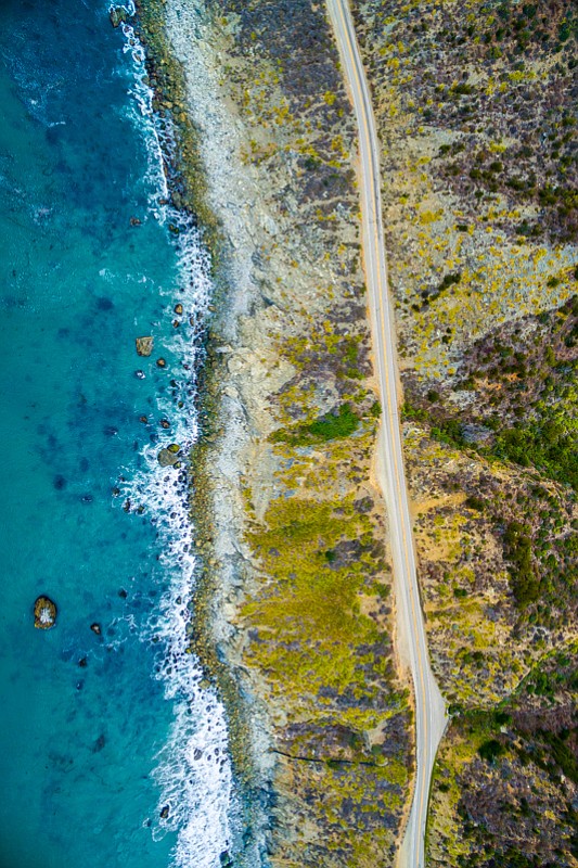 An aerial perspective of Hwy 1 and the majestic Big Sur Coastline.