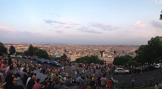 Crowds gather to take in the view at Paris's Sacré-Cœur basilica, the highest point in the city. 