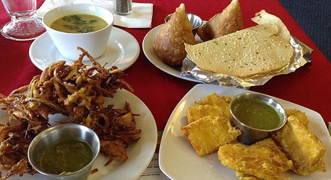 The meal: pakoras, dhal soup, samosas, papadum, and paneer pakauda, all for about $15