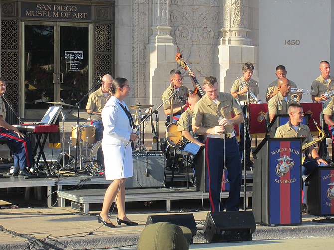 Guest vocalist and musician, 3rd class Naval Officer Andrea Pharis and Marine Sergeant Chipp Corderman with Marine Band San Diego.