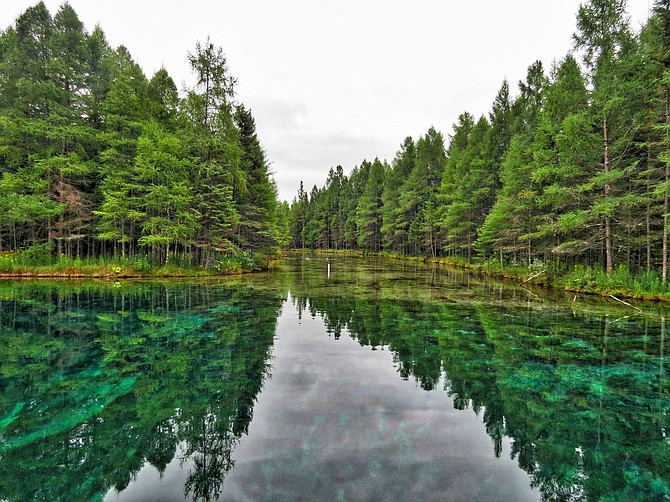 Kitch-iti-kipi is Michigan's largest natural freshwater spring. Its original name was the "Mirror of Heaven" given to it by the early Native Americans.