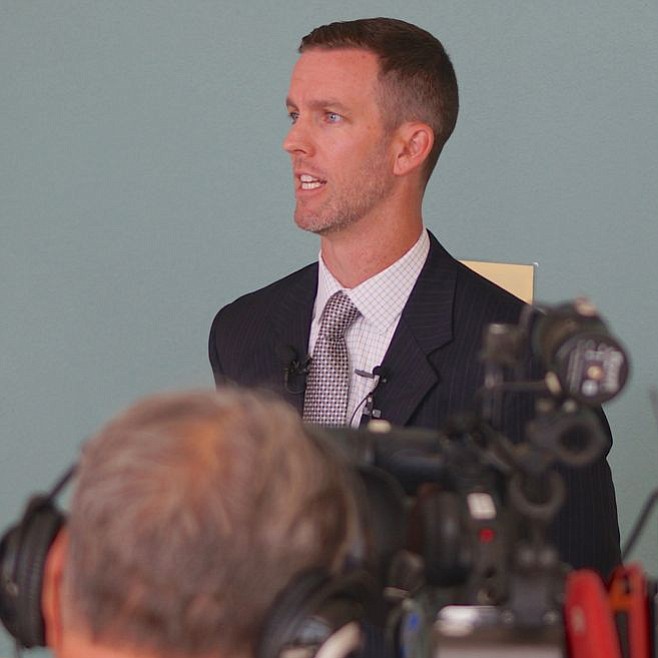 Prosecutor Ryan Saunders spoke to news cameras. Photo by Weatherston