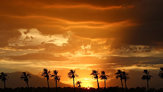 A Hawaiian sunset?  Not quite, but close, this is a gorgeous sunset from Indio, CA.  Taken during our monsoon season just last month.  
"it's a Vilma!"