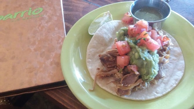 The carnitas tacos are street.