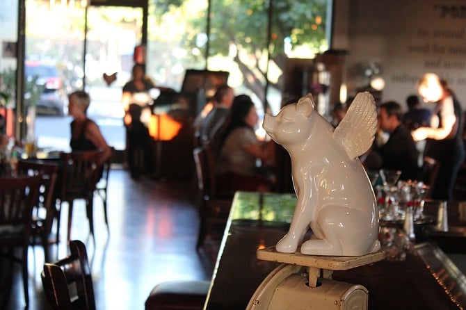 Flying Pig's mascot watched over diners and they enjoy food and craft beer.