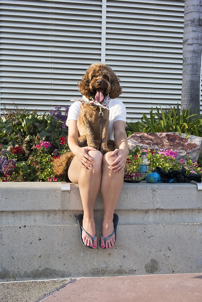 Woman with dog outside San Diego Convention Center, 111 West Harbor Drive, San Diego, CA, taken at 5:40 p.m., Sept. 19, 2015.