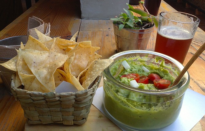 Guacamole appetizer and beer
