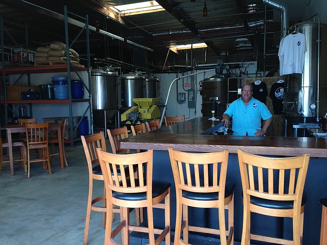 Bay Bridge co-founder Jim Shirey tends bar in his new tasting room.
