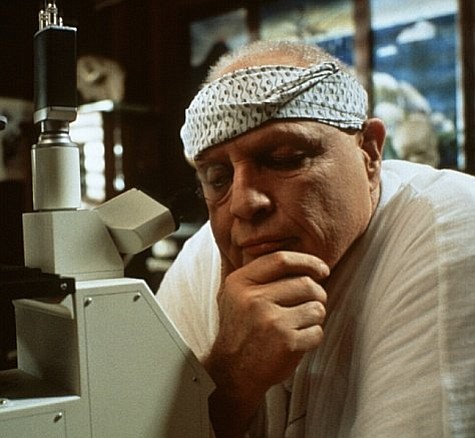 Dr. Moreau in his lab, musing on the notion that little boys are made of snakes and snails and puppy dog tails.