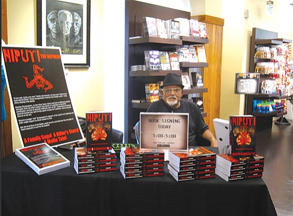 Joe Bonpensiero signing books at the Mob Museum in Las Vegas