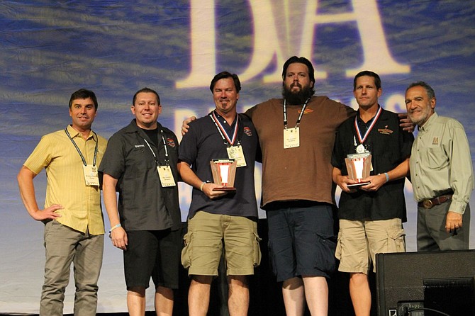 Paul Sangster and Guy Shobe hold trophies as Rip Current wins Very Small Brewery of the Year.