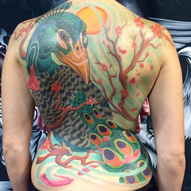 This is a freehand peacock back piece of a client collaboration design. More photos available on www.TimLeesTattoo.com or Instagram @timstat2