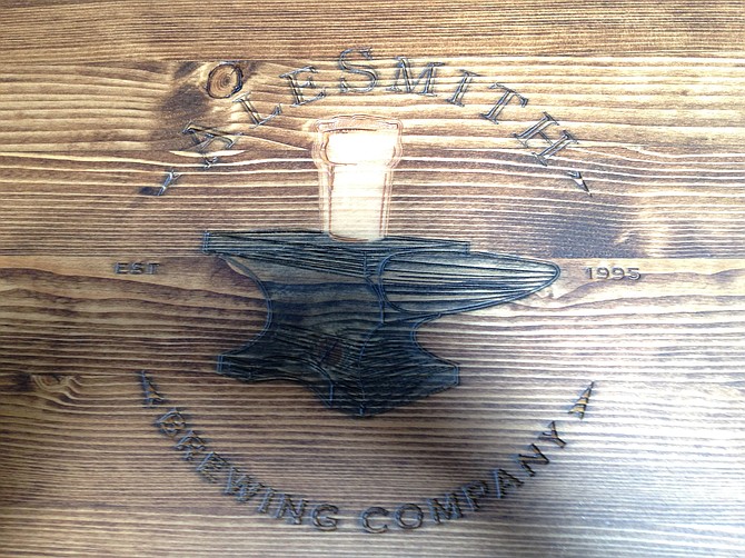 The AleSmith emblem adorning its tabletops.