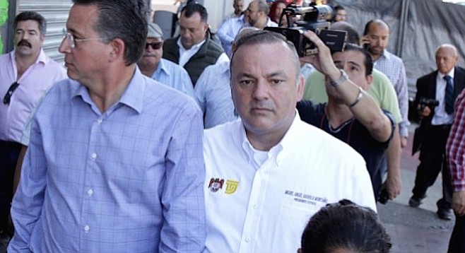 Tijuana mayor Jorge Astiazarán Orcí (left) and Miguel Ángel Badiola Montaño, president of Tijuana's tourism and conventions committee, on a Zona Norte walking tour October 23