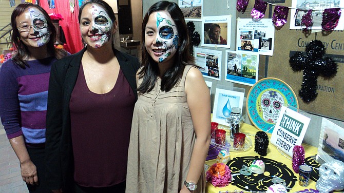 Quynh Njuyen, Isela Ramos and Trinh Le at climate change altar at the Day of the Dead kickoff party
