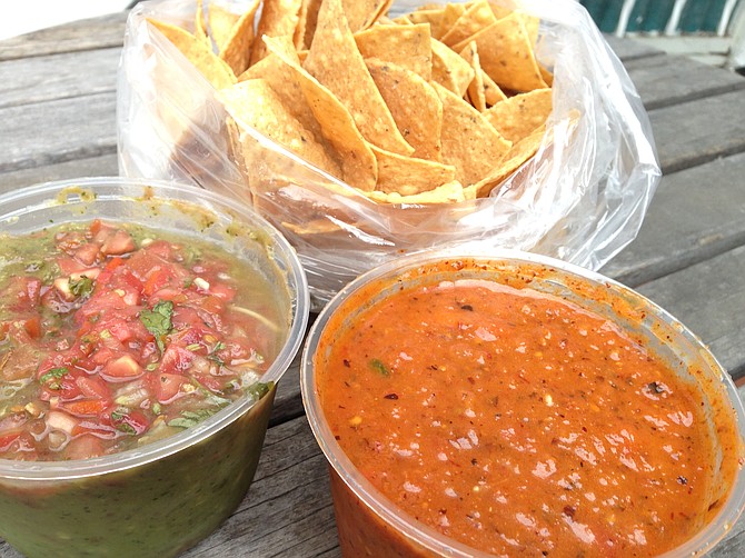 Fresh chips, guacamole, and a tub of Sonia Campos’s chipotle salsa