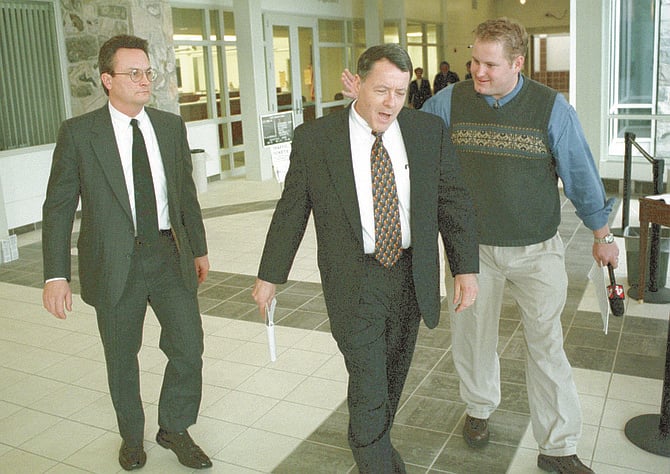 Robert Weitzel (left) and attorney Peter Stirba (center). Stirba has argued that much of the evidence against his client is circumstantial.