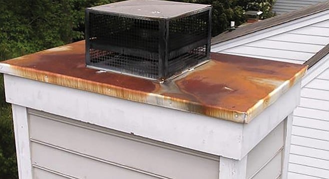 Chimney with rusted chase cover