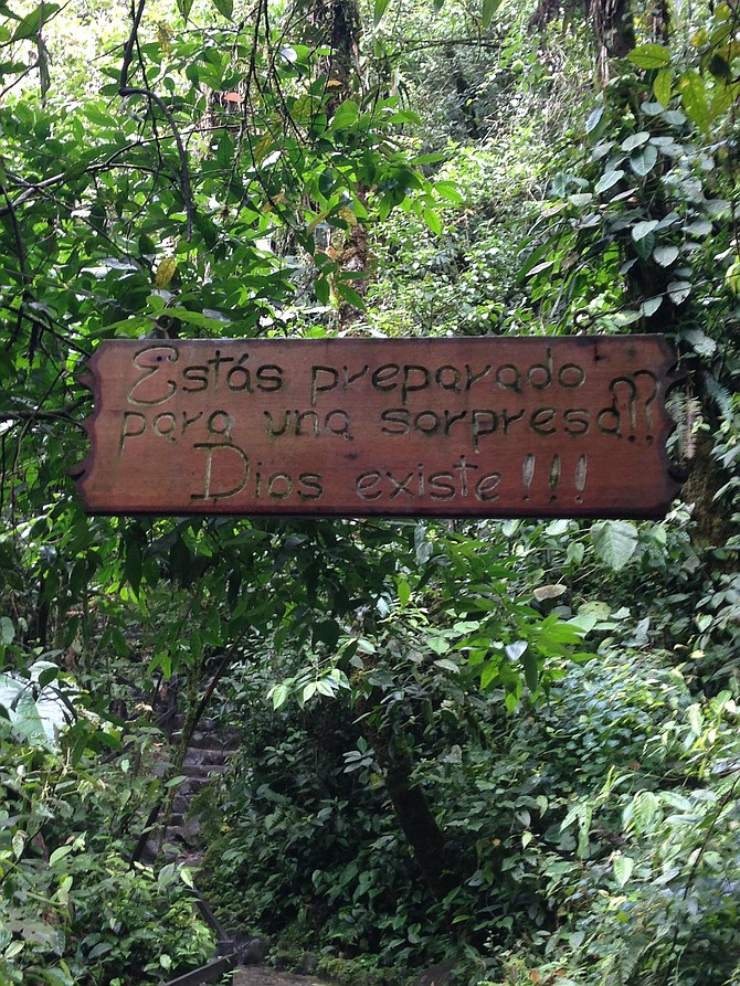 Sign strung across the trail. 