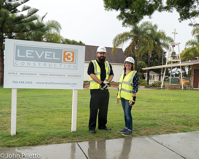 Fr. Doran Stambaugh and Eileen Hoppen with Level3 Construction on demolition day.