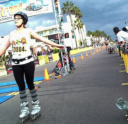 An inline skater crosses the finish line in Imperial Beach.