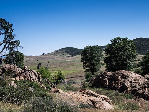 The Soapstone Grade Fire Road has metamorphic boulders and views of the grasslands beyond.