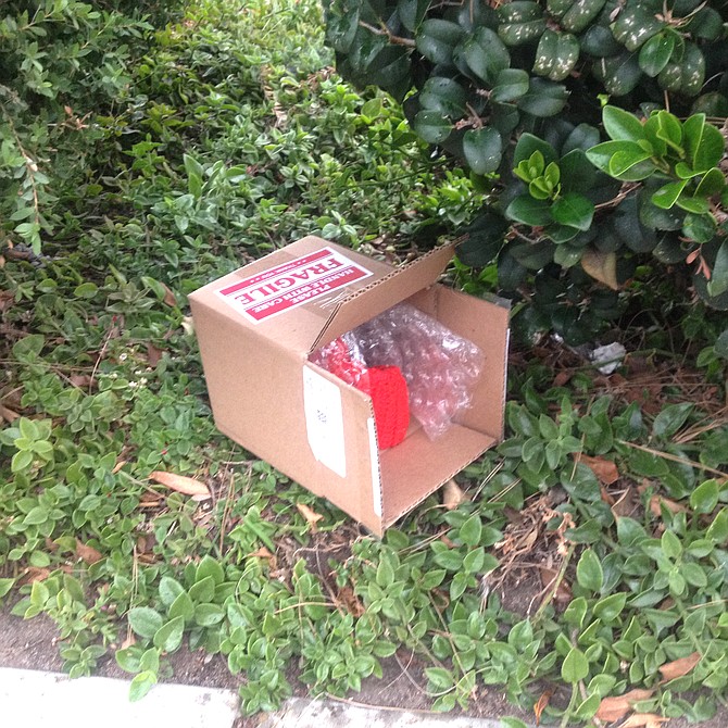 A neighbor found this box "with something red that someone had knitted" and took it to the specified address