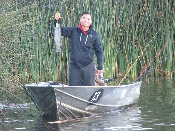 Bonita's Thai Dinh land the first trout of the Lake Wohlford season