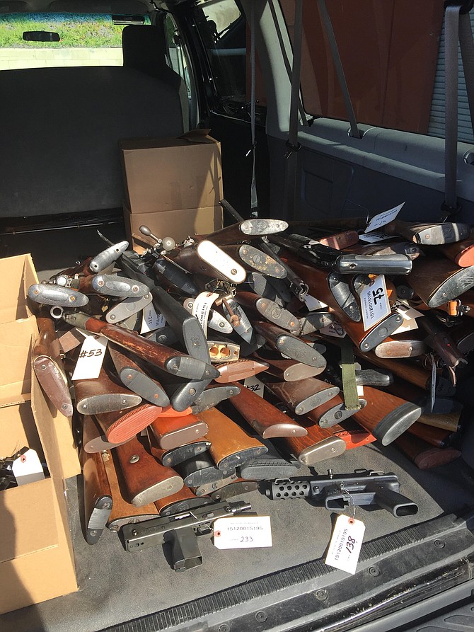 Guns taken in on December 19 in the back of a police van