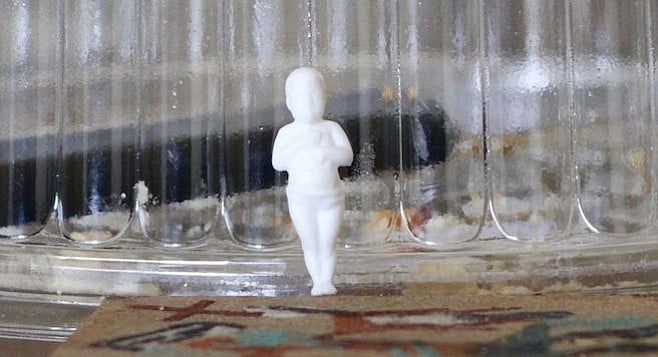 Small plastic jesus figurine found in a $2.50 rosca