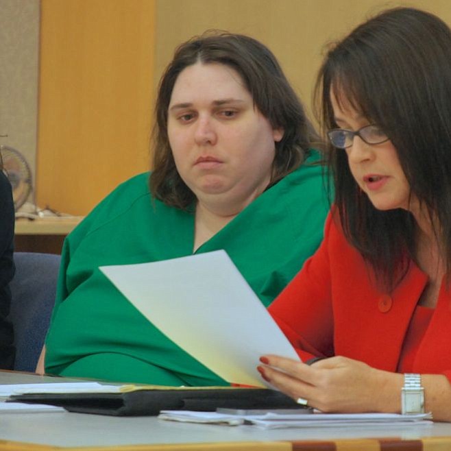 Lopez listened attentively as her attorney read the letter f her father. Photo by Eva