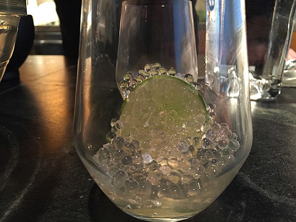 Tonic spheres in glass, just before we poured gin over them

