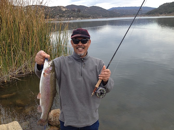 Ray Madamba of Rancho Penasquitos catches a nice rainbow at Lake Wohlford, January 13, 2016