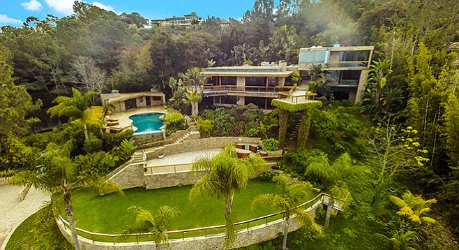 The La Jolla mansion and its multi-tiered backyard sit on the northwestern slope of Mt. Soledad.