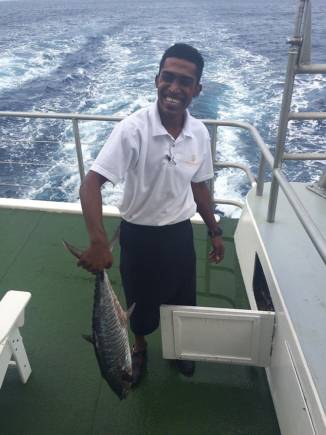 Blue Lagoon cruise ship staff with freshly caught fish
