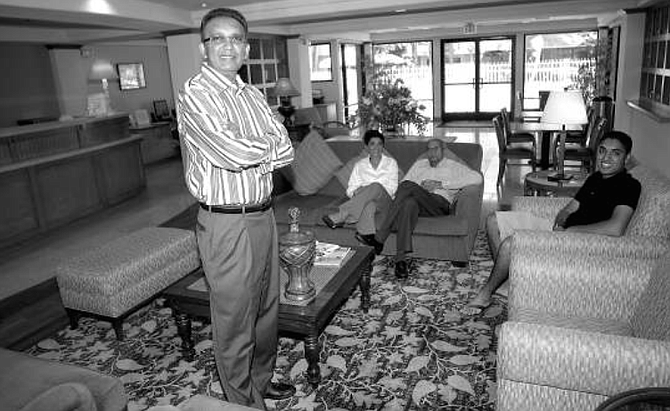 Barry, Hema, Lalbhai, and Arjun Lall. From 1993 to 2000, Naresh and the family saved $40,000. They saved on rent by living in the motel; and, when the whole family works for the family business, labor costs are nil.  - Image by Derek Plank