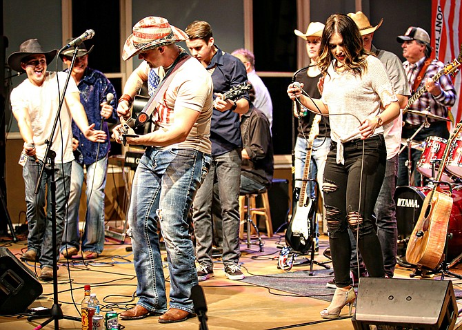All artists and musicians hit the stage for one last song!
Headliner Greg White Jr, Award Winning and CMT featured Country Artist/Songwriter Mike Lounibos, Opener Josh Miranda, and Opener Dannie Marie. "Country at the Grand" in support of Homes for Our Troops.

Photo by Greg Nickel, Gg Images