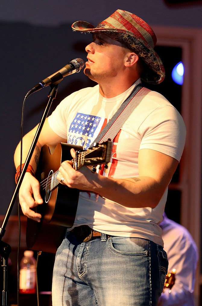 Headliner Greg White Jr. performs LIVE at "Country at the Grand" in support of Homes for Our Troops.

Photo by Greg Nickel, Gg Images