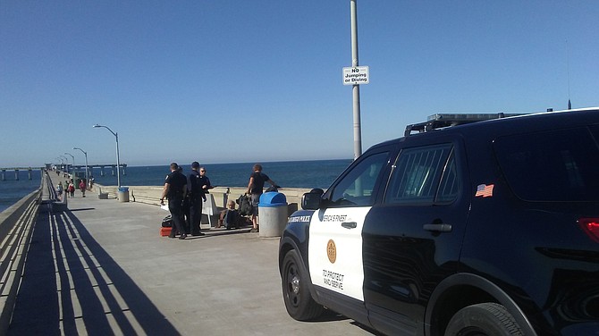 Police respond to unruly Pier patrons.
