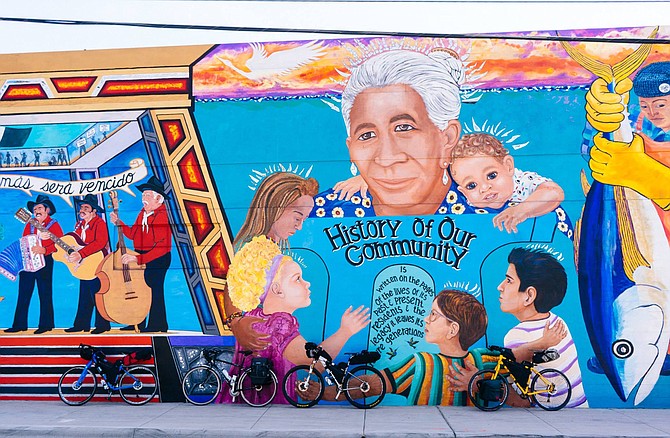 A painted mural by Chicano Park celebrating our community and some of San Diego's history.