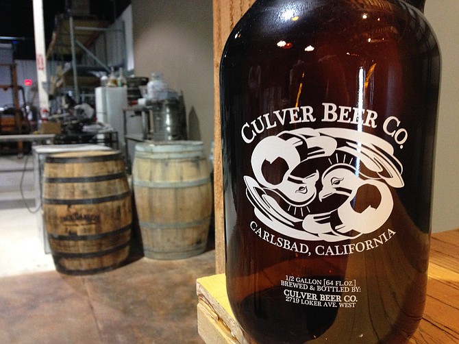A Culver Beer growler awaits build-out of the new beer company's tasting room