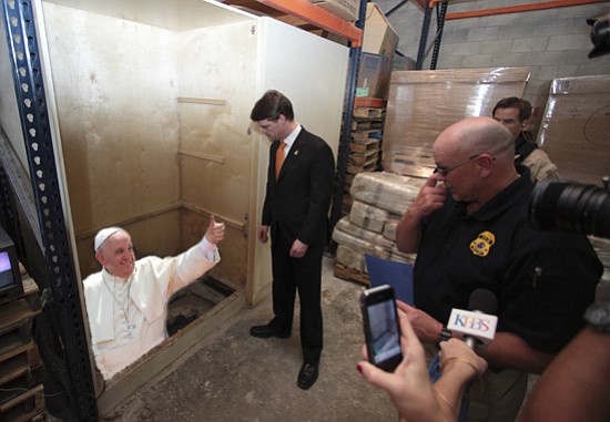 Making an entrance: Pope Francis gives a happy thumbs up to United States diplomatic and immigration officials as he emerges from a cross-border tunnel into a San Ysidro Wal-Mart warehouse facility. “It was very considerate of Mr. Pope to let us know exactly when and where he would be arriving,” said ICE Commander Wally Brownout. “But of course, we still had to take him into custody. He’s a foreign national entering the United States through irregular channels, and the law is the law. When I explained that to him, he said that Pontius Pilate probably told himself the same thing. I have to admit, that stung a little."