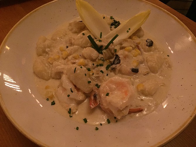 The gnocchi at Madison is served with endive, jumbo shrimp and corn in a truffle cream sauce.