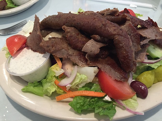 Gyro salad, with a generous portion of meat